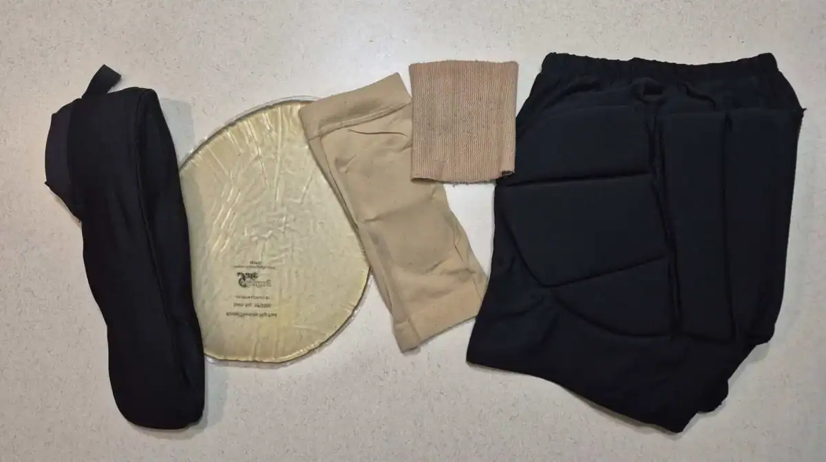 Protective gear for figure skating including a padded head band, a knee/hip pad, Bunga pads for the ankle and heel, and crash pants