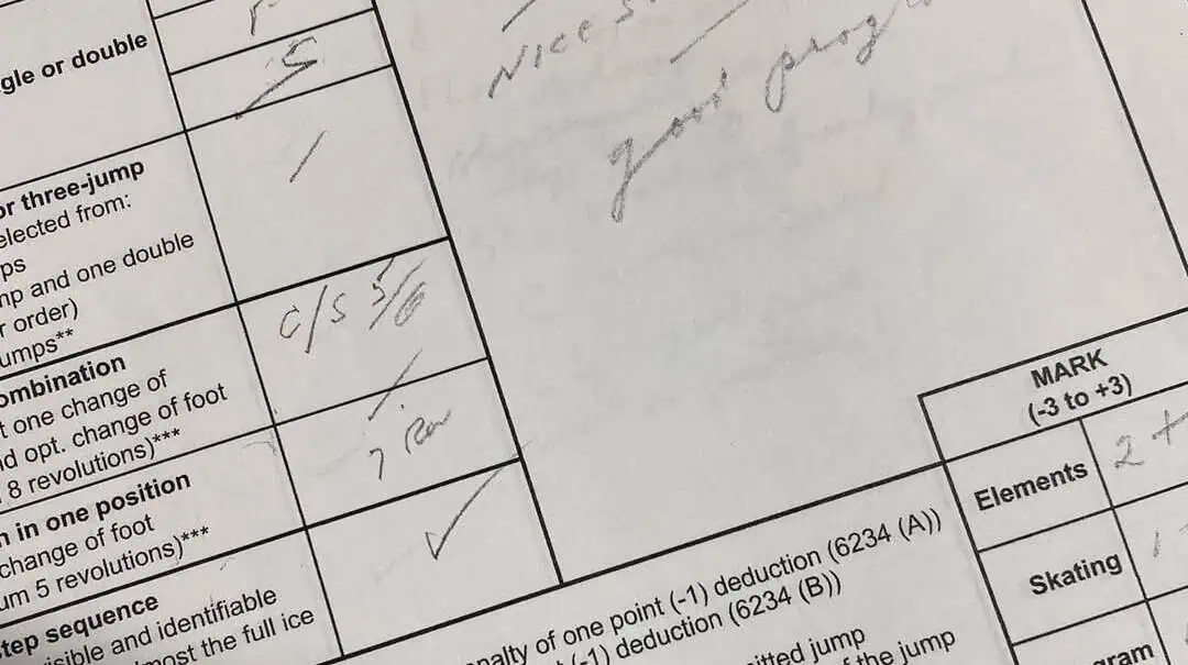 Close up of a section of a figure skating test results sheet showing the results of a skating skills test, angled to the left
